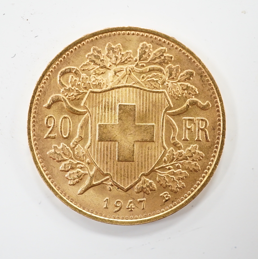 A Swiss 1947 gold 20 franc Helvetia coin.